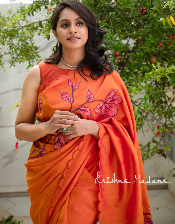 Orange pure silk saree with vibrant colors